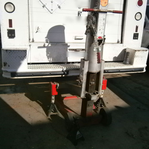 Inspecting trailer lights during safety check