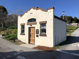 A small building in Davenport, California, featuring a side door and a simple architectural design.