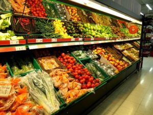 A large, appealing display of fresh produce in a grocery store in Rio Del Mar, California, featuring an array of colorful options.