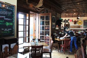 A cozy restaurant in Scotts Valley, California, featuring neatly arranged tables and chairs in the dining area.